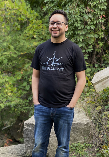 Black bamboo unisex t-shirt on a man with a stylized rising sun graphic above the word &quot;Reslilient&quot;