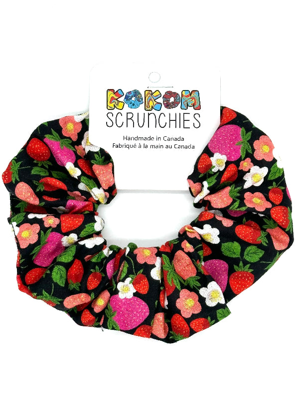 Scrunchie with strawberry pattern on a white background, featuring &