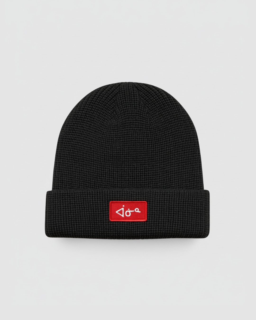 Black beanie with a red logo on a light gray background