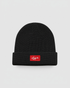 Black beanie with a red logo on a light gray background