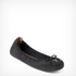 Black moccasin shoe flat with a bow on a white background