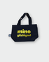 the back side of a black Mino giizhigad tote bag with a yellow smiley face design on a white background