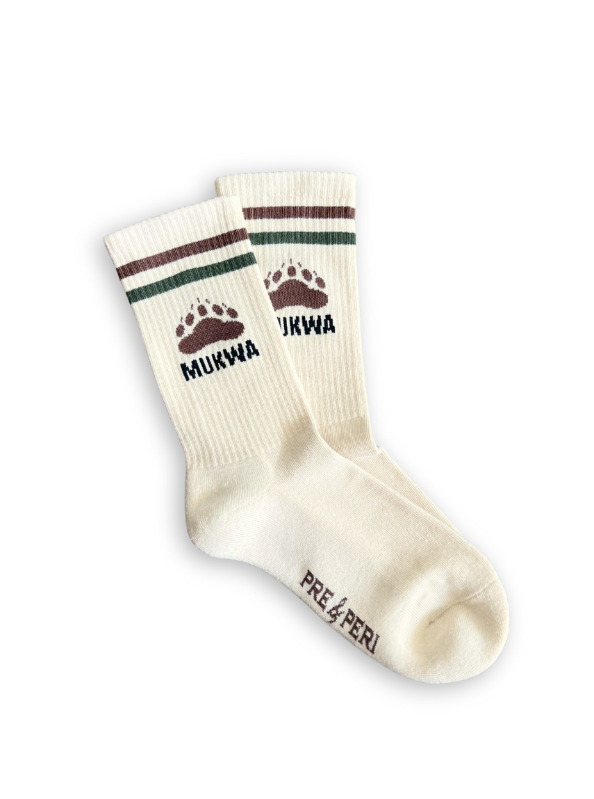 Pair of cream socks with brown and green accents and &