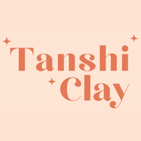 Tanshi Clay logo in a square format. The brand is in a rusty, pastel orange font. Surrounding it are three four-point stars while the logo sits against a peach background colour. The brand Métis made beaded flower earrings, fringe earrings, and pins with stickers.