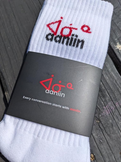 aaniin ankle socks in their branded packaging.