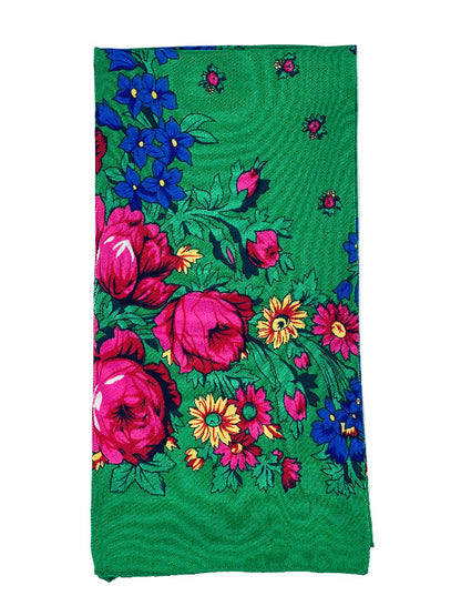 Floral patterned fabric on a green background